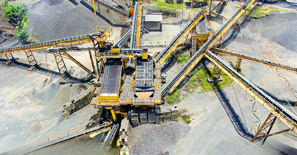 An aerial view of a massive stone crushing and screening plant featuring our high-capacity **quarry rock crusher** systems.